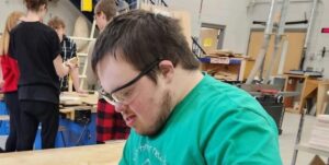 Young adult working in a gymnasium.