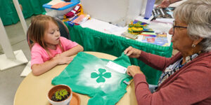 Kid doing arts and crafts.